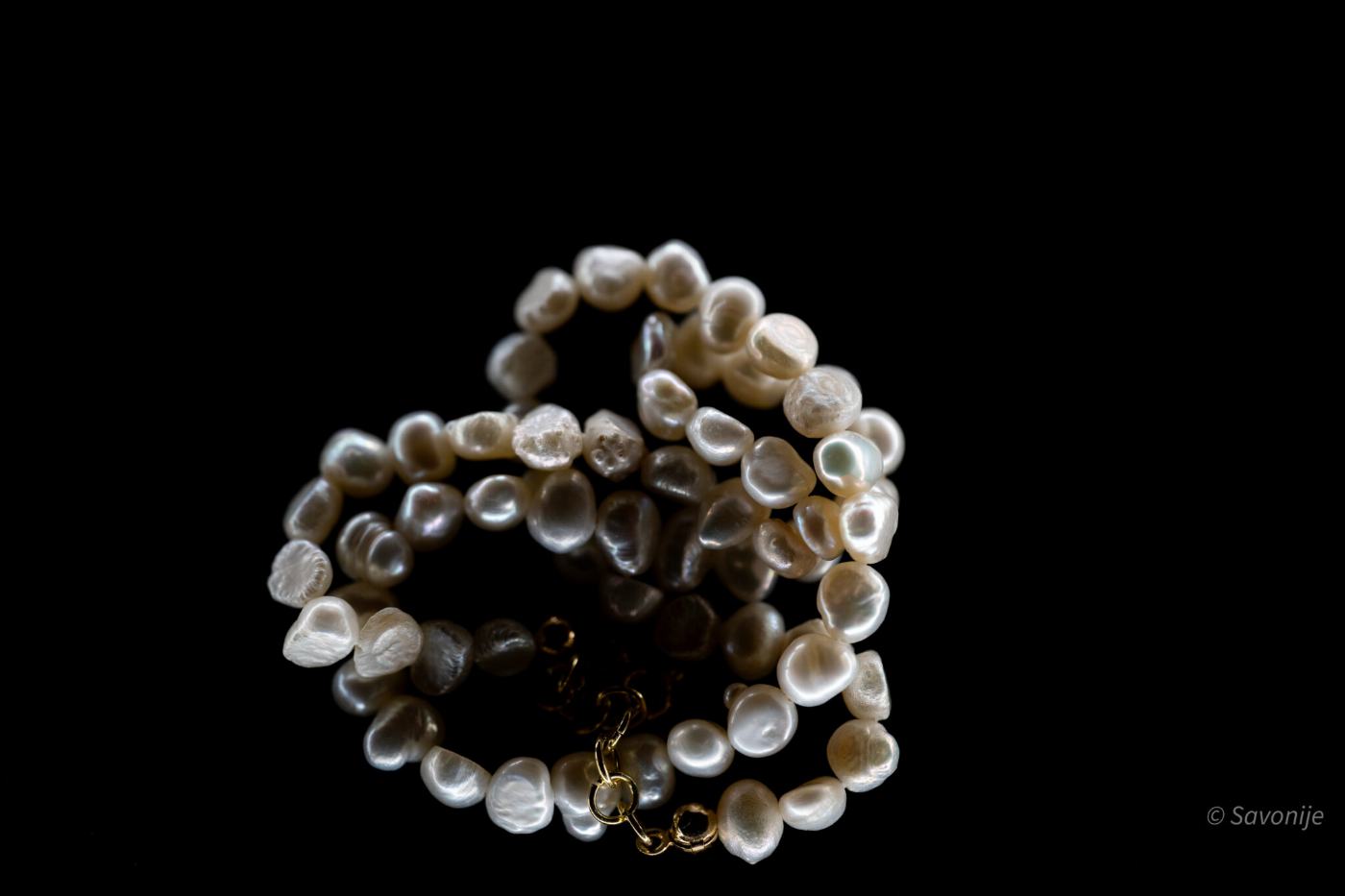 A pile of baroque freshwater pearls catching the light